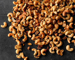 Adding cashew nuts to the pan