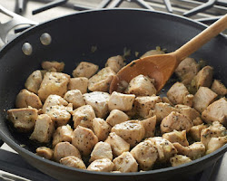 Adding chicken to the pan