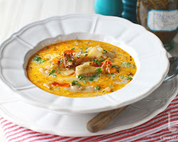 Ciorba de fasole in bowl with sour cream and parsley