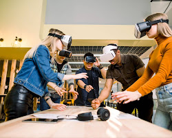 group of people using a virtual reality headset