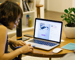 person writing on a computer